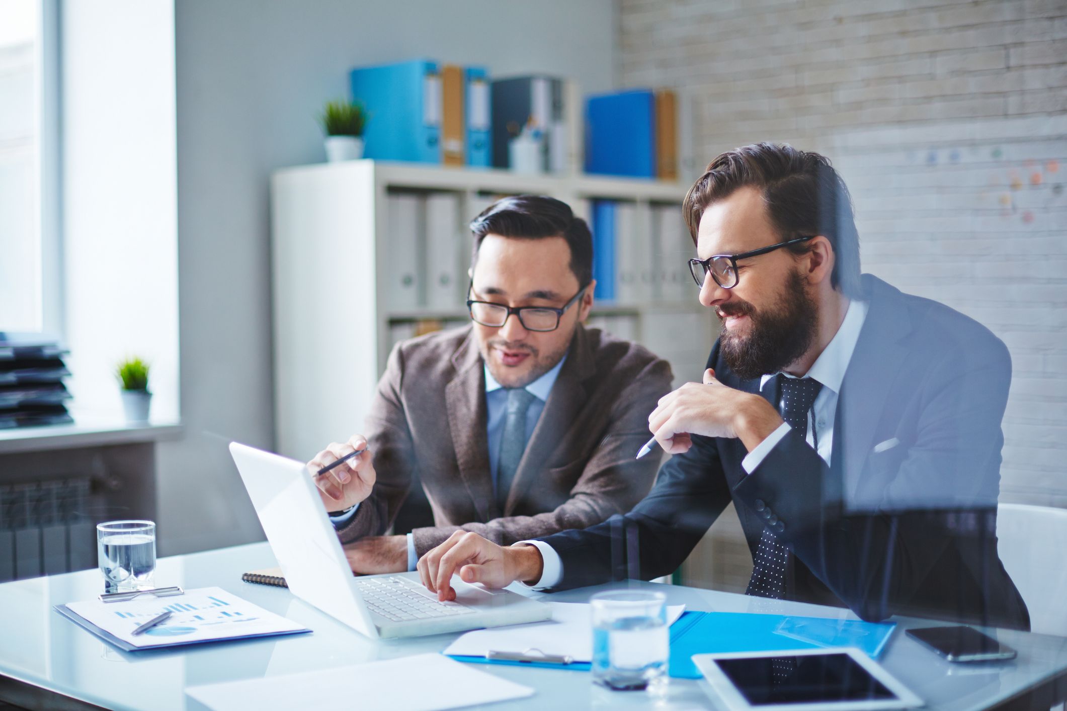 Advisors reviewing work together