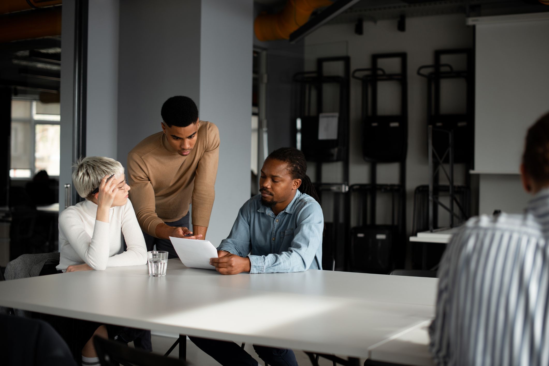 Team reviewing work at a table
